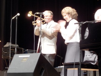 Bro. Jerry playing trumpet and Little Jan